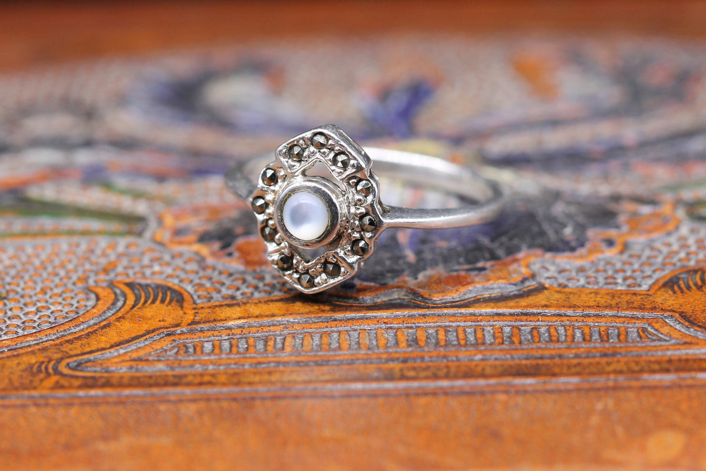 Lovely Silver Ring with central Moonstone and surrounded by dark marquisette stone