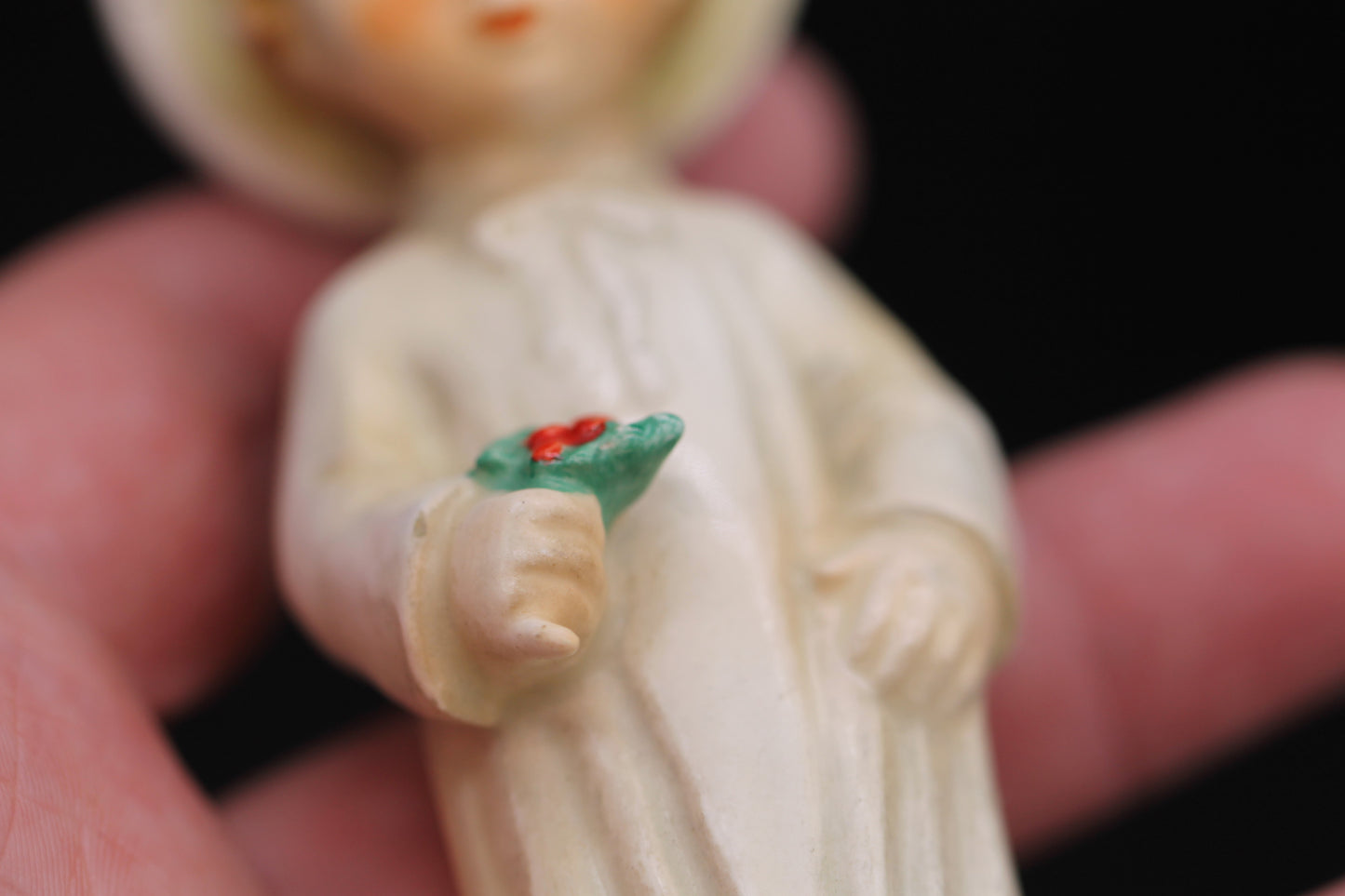 Vintage Christmas themed figurine of a young child in long smock with holly designed by Janet Robson Figurines by Goebel c1957