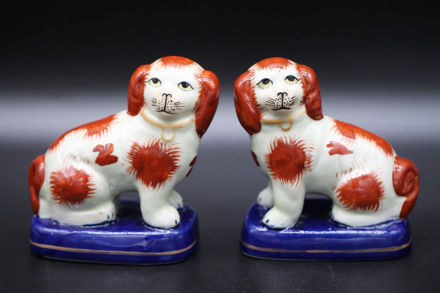 Miniature Staffordshire Pottery Figures of Russett Spaniel Dogs on Blue Bases c1900