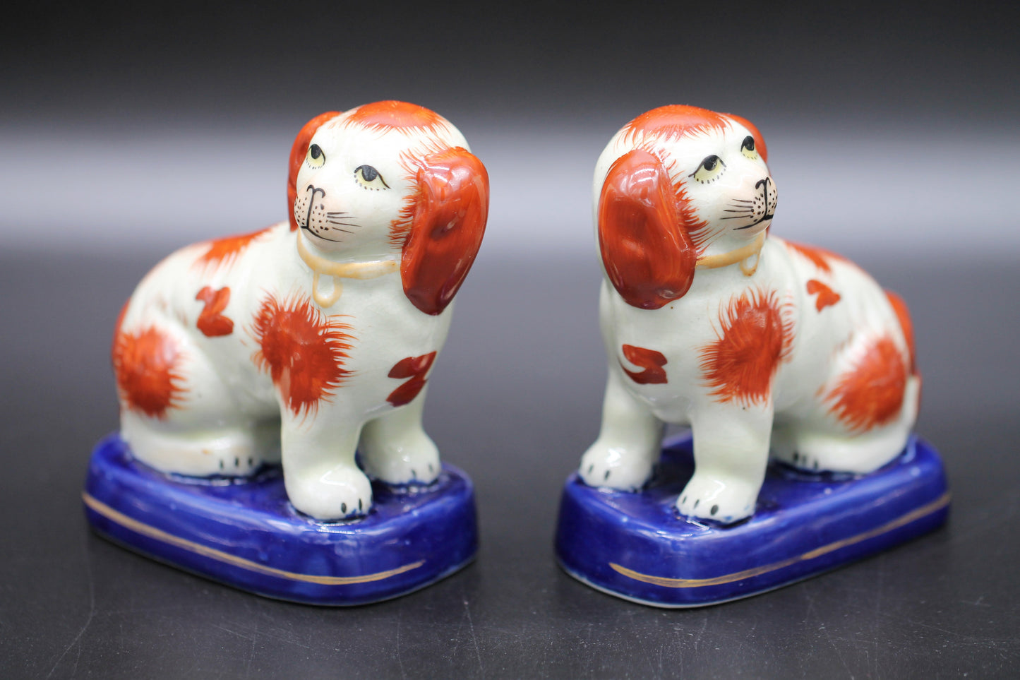 Miniature Staffordshire Pottery Figures of Russett Spaniel Dogs on Blue Bases c1900